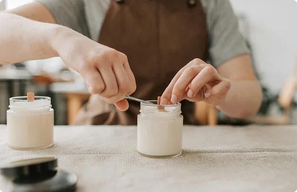 someone lighting a candle