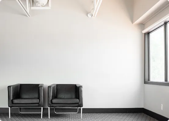 two single person chairs beside each other.
